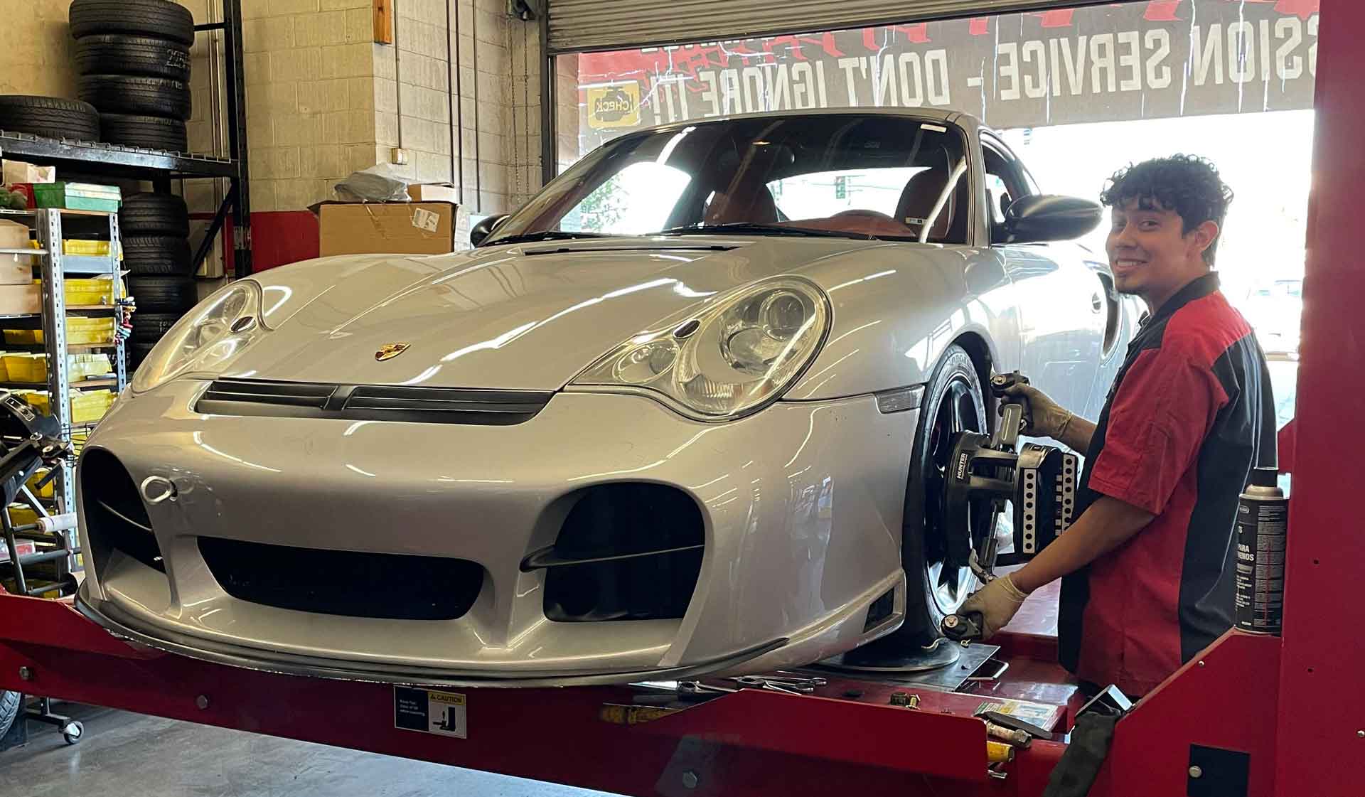 Certified Technician Performing A 4 Wheel Alignment